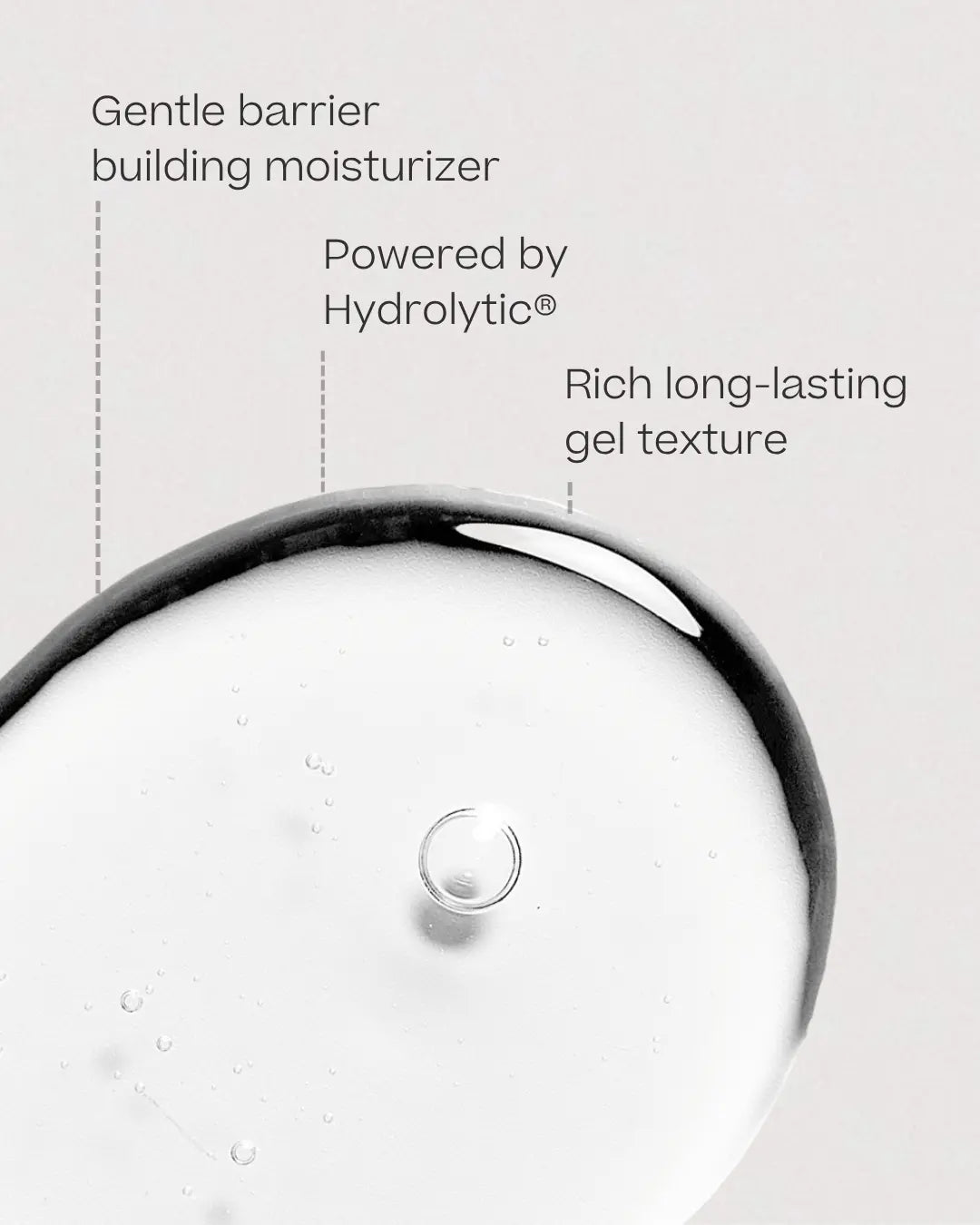 A close-up of a clear gel or liquid droplet hydrolytic face moisturizer on a light gray background with text callouts reading 'Gentle barrier building moisturizer,' 'Powered by Hydrolytic®,' and 'Rich long-lasting gel texture.'.