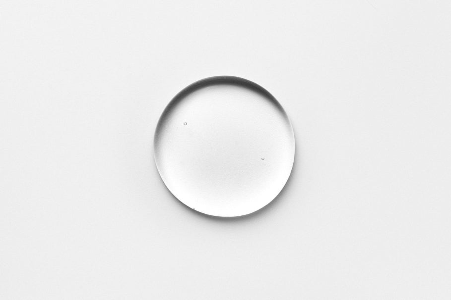 a drop of the fjör serum on a white background with small air bubbles