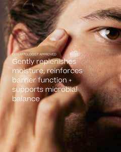 Close-up of a man's face with a hand applying or spreading a glossy skincare product onto his cheek. White text overlays read 'DERMATOLOGIST APPROVED' and 'Gently replenishes moisture, reinforces barrier function + supports microbial balance'.
