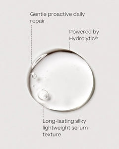 A clear circular droplet of hydrolytic serum on a light gray background with text labels reading 'Gentle proactive daily repair,' 'Powered by Hydrolytic®,' and 'Long-lasting silky lightweight serum texture.'.